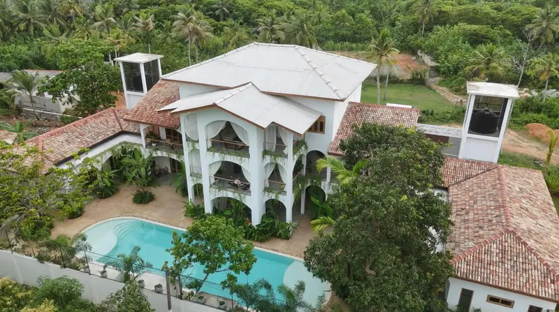 Aerial view of the villa, pool and surrounding jungle in Unawatuna