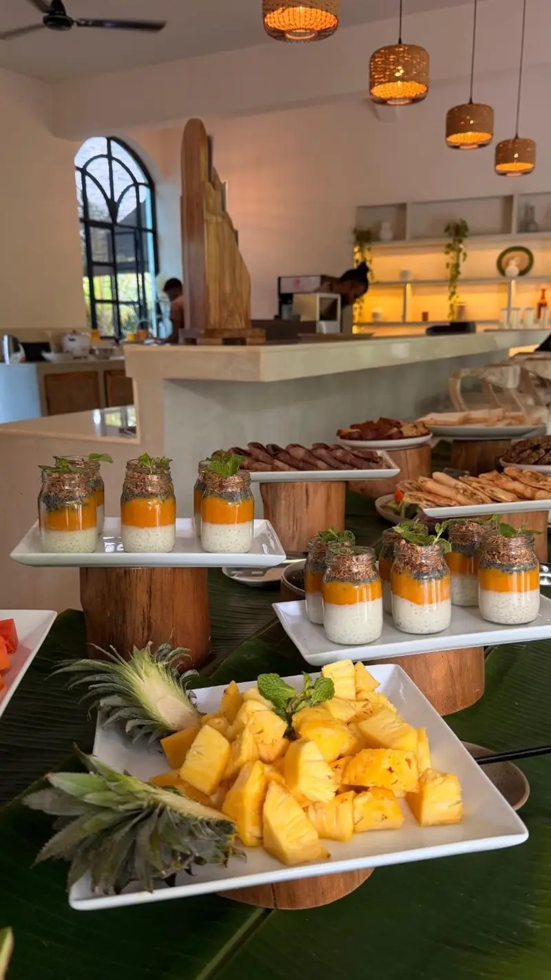 Pastries, parfaits and pineapple on the breakfast counter