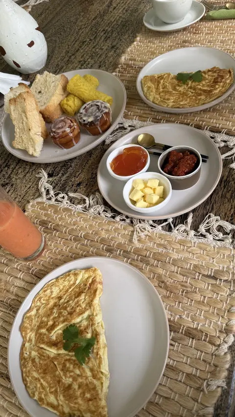 Omelette, toast and small plates at breakfast