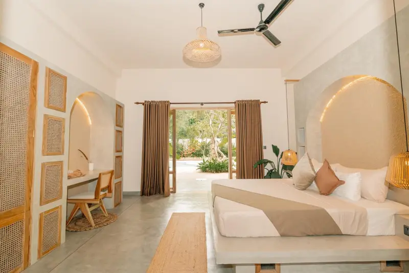 Deluxe Room seen from the desk towards the veranda doors