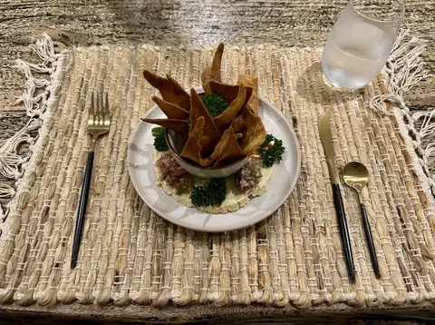 Dinner plate topped with crisp plantain chips