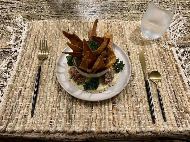 Dinner plate topped with crisp plantain chips