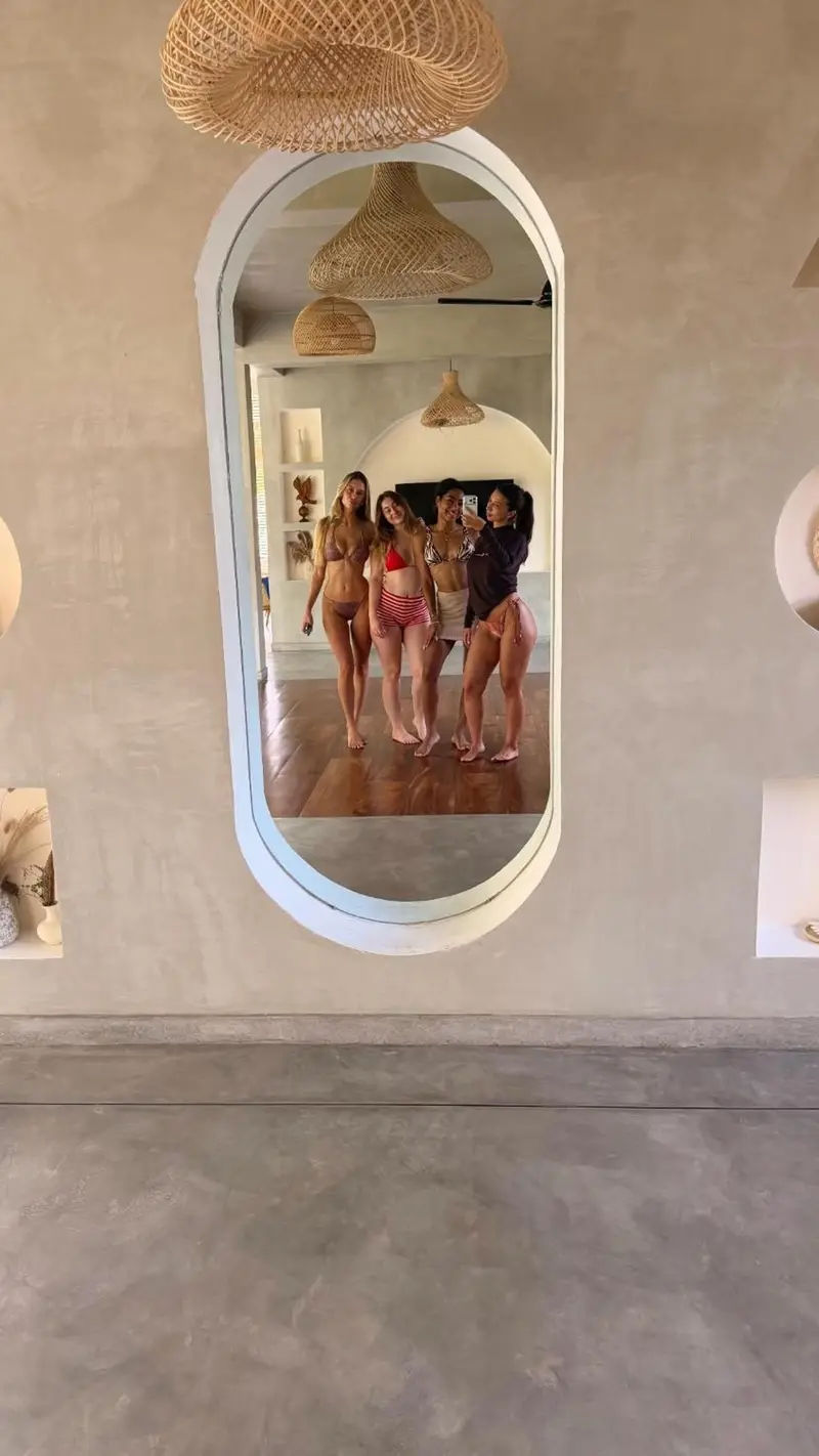 Friends taking a mirror photo in the yoga room