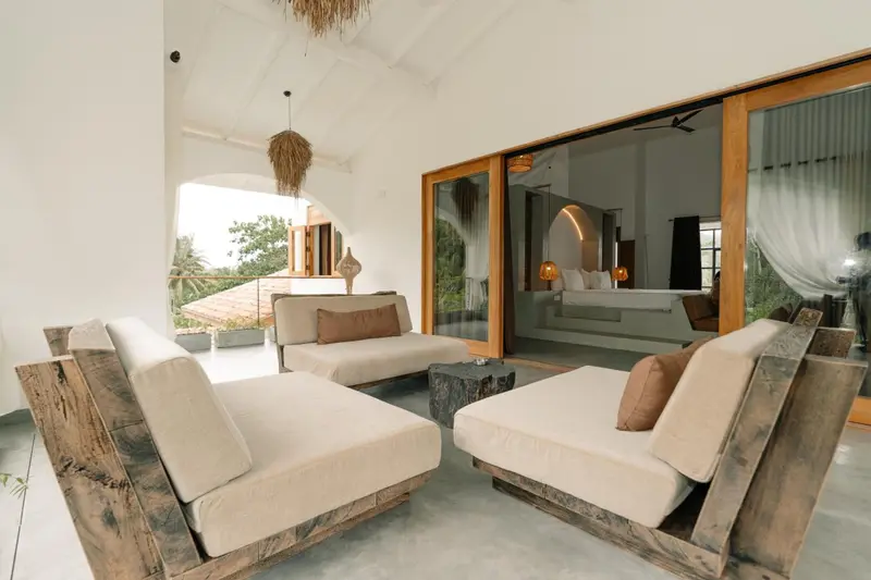 Lounge with timber sofas and linen cushions