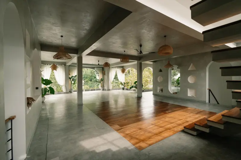 Wide view of the yoga space and lounge